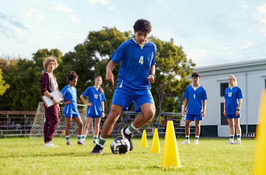 Young athletes practice soccer drills together while improving confidence through Bearcat Coaching mindset training and teamwork every day.