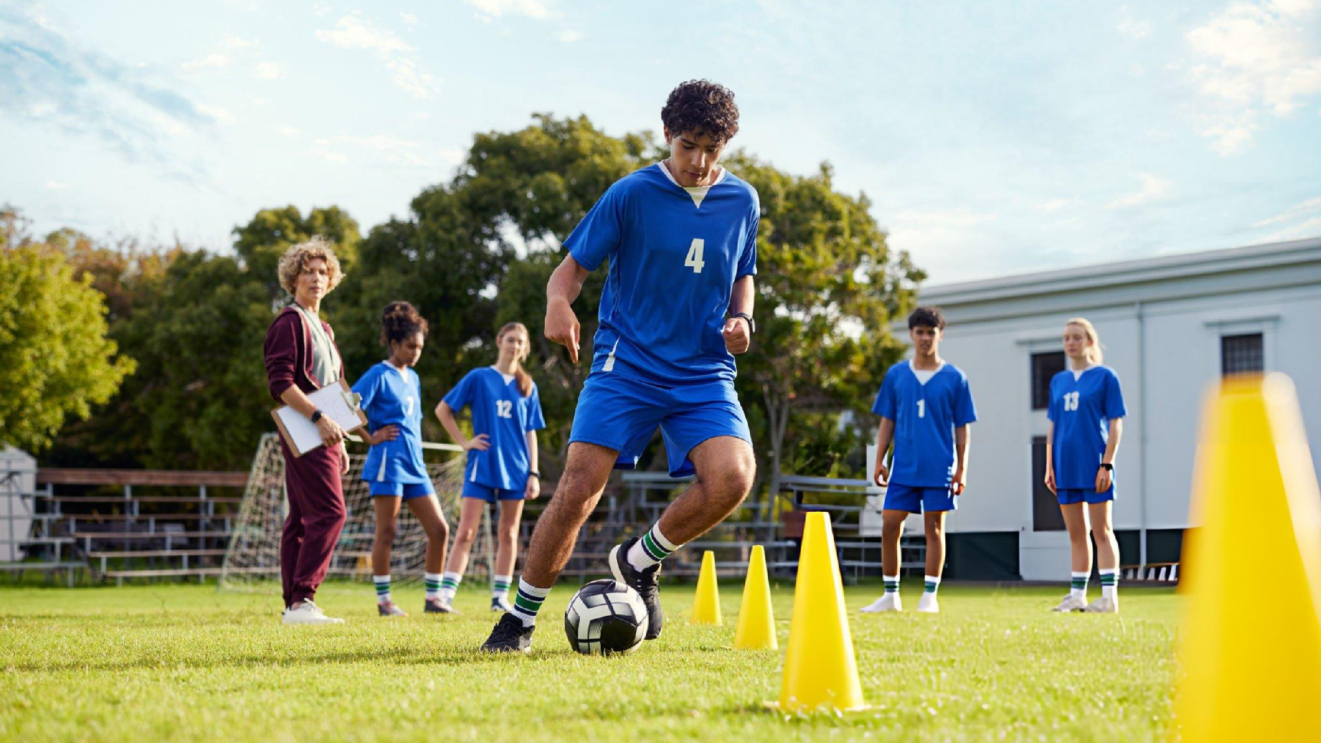 Young athletes practice soccer drills together while improving confidence through Bearcat Coaching mindset training and teamwork every day.