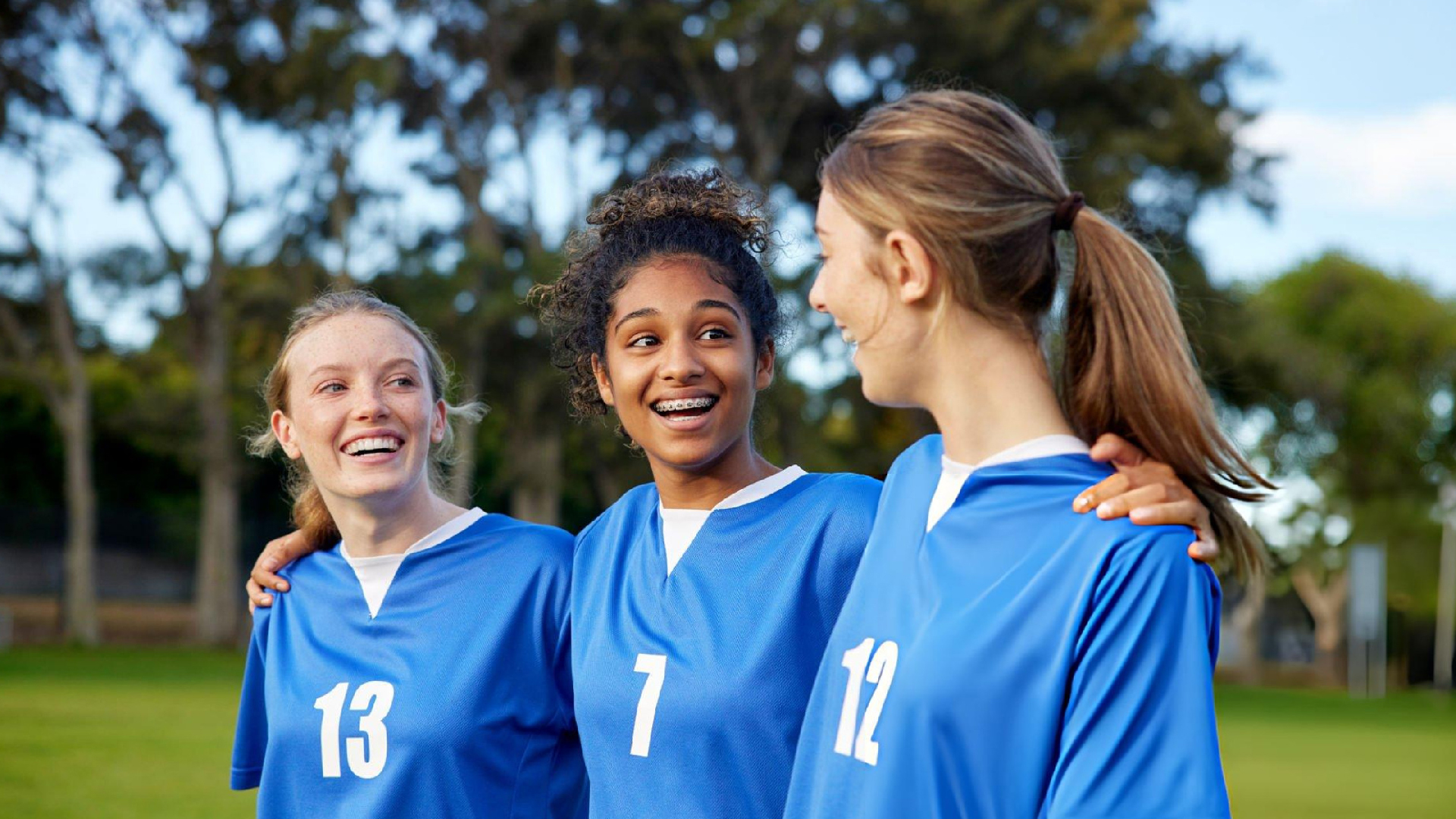 Young teammates celebrate friendship and confidence while embracing Bearcat Coaching values for teamwork, resilience, and lasting athletic success together.