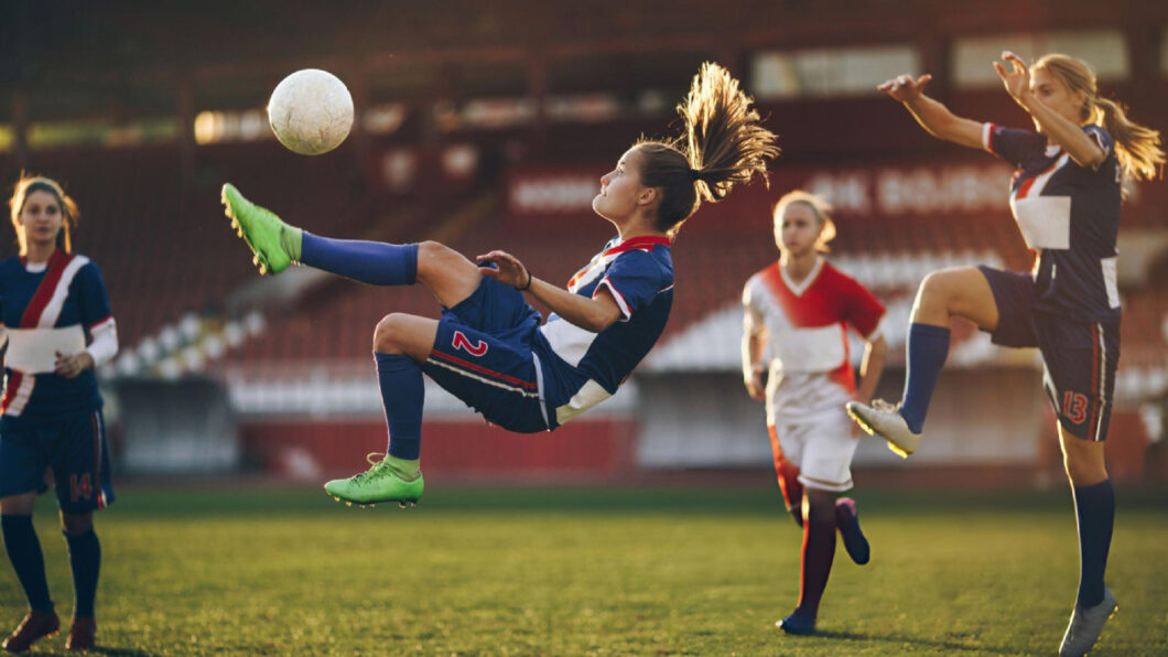 Football athlete demonstrates determination during competition while applying Bearcat Coaching mental performance strategies for success on field.